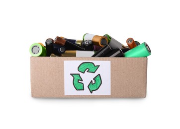 Image of Used electric batteries in cardboard box with recycling symbol on white background