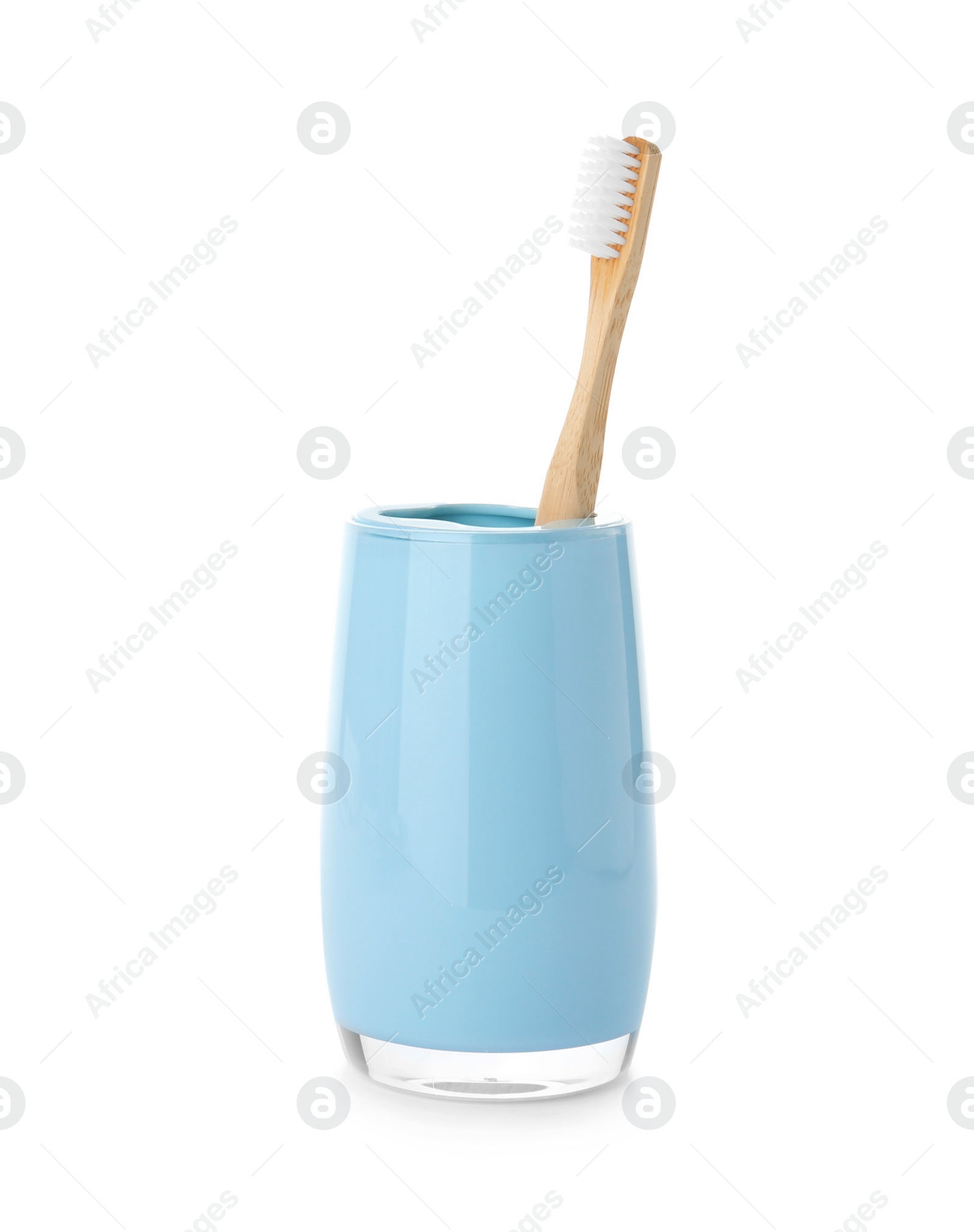 Photo of Bamboo toothbrush in holder on white background. Dental care