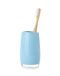 Photo of Bamboo toothbrush in holder on white background. Dental care