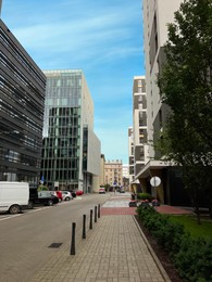 Photo of Beautiful viewmodern buildings and car parking lots on city street