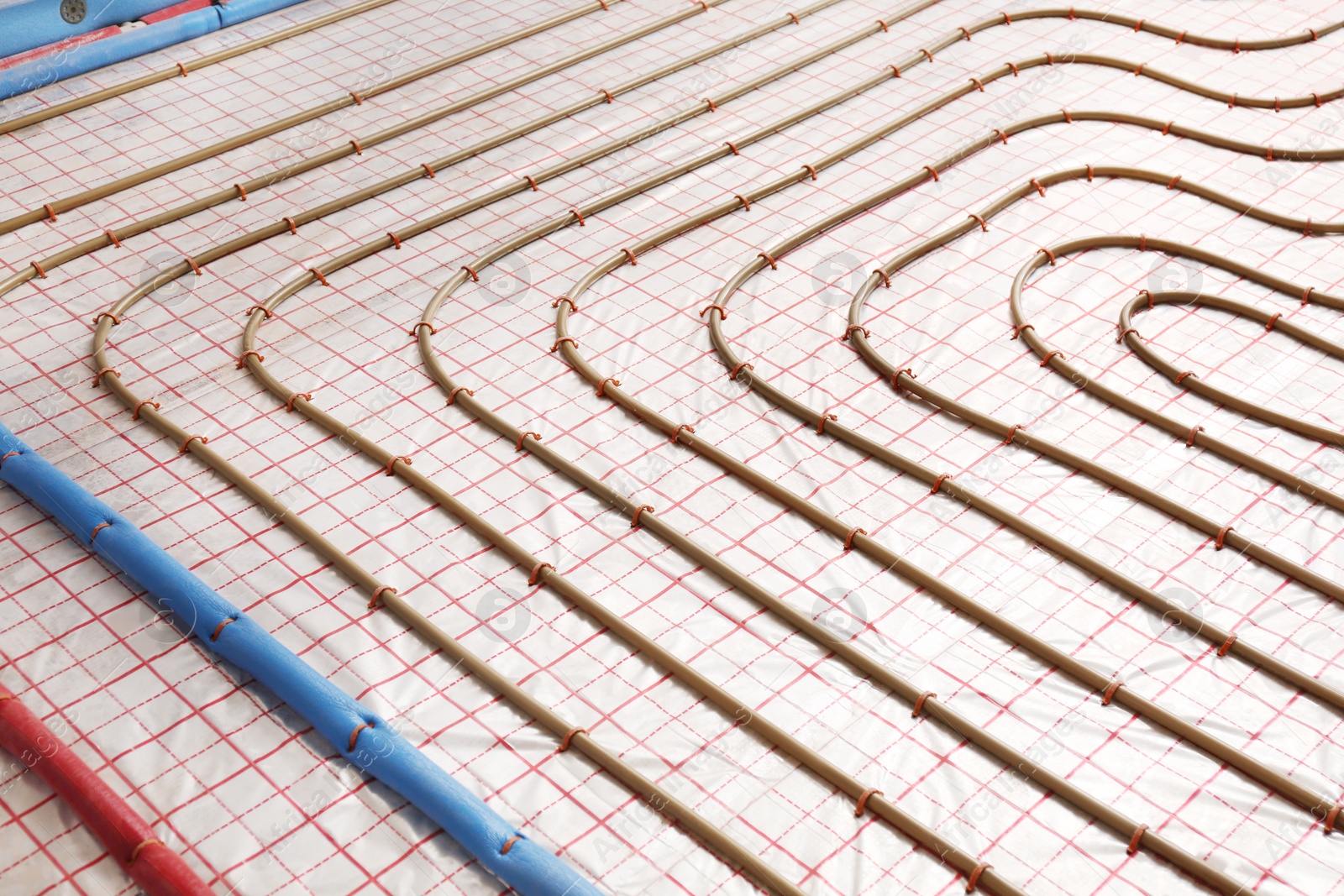 Photo of Installation of underfloor heating system in building