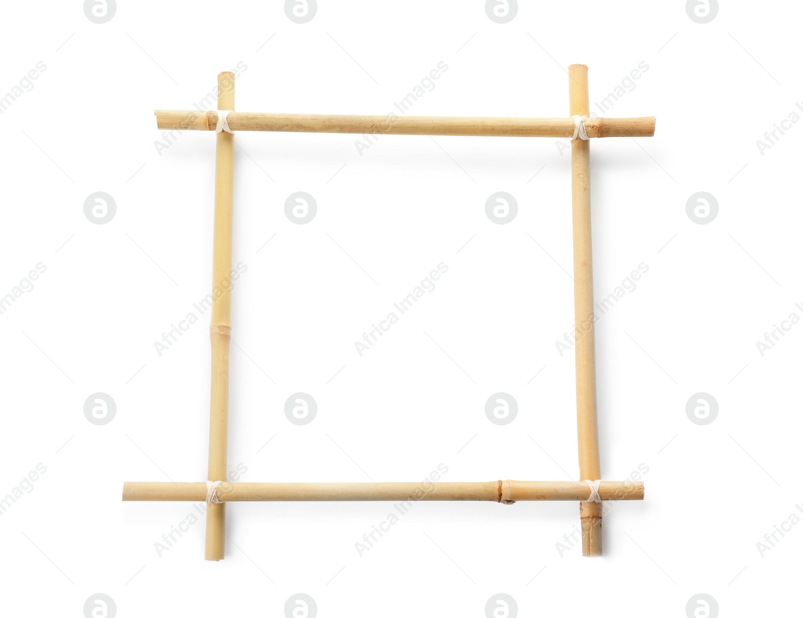 Photo of Frame made of dry bamboo sticks on white background. Space for design