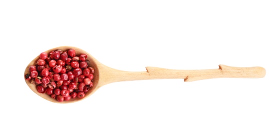 Photo of Spoon of red peppercorns isolated on white, top view