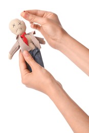 Woman stabbing voodoo doll dressed as businessman with pin on white background, closeup