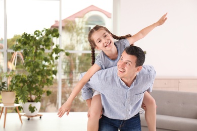 Photo of Father with cute child at home. Happy family