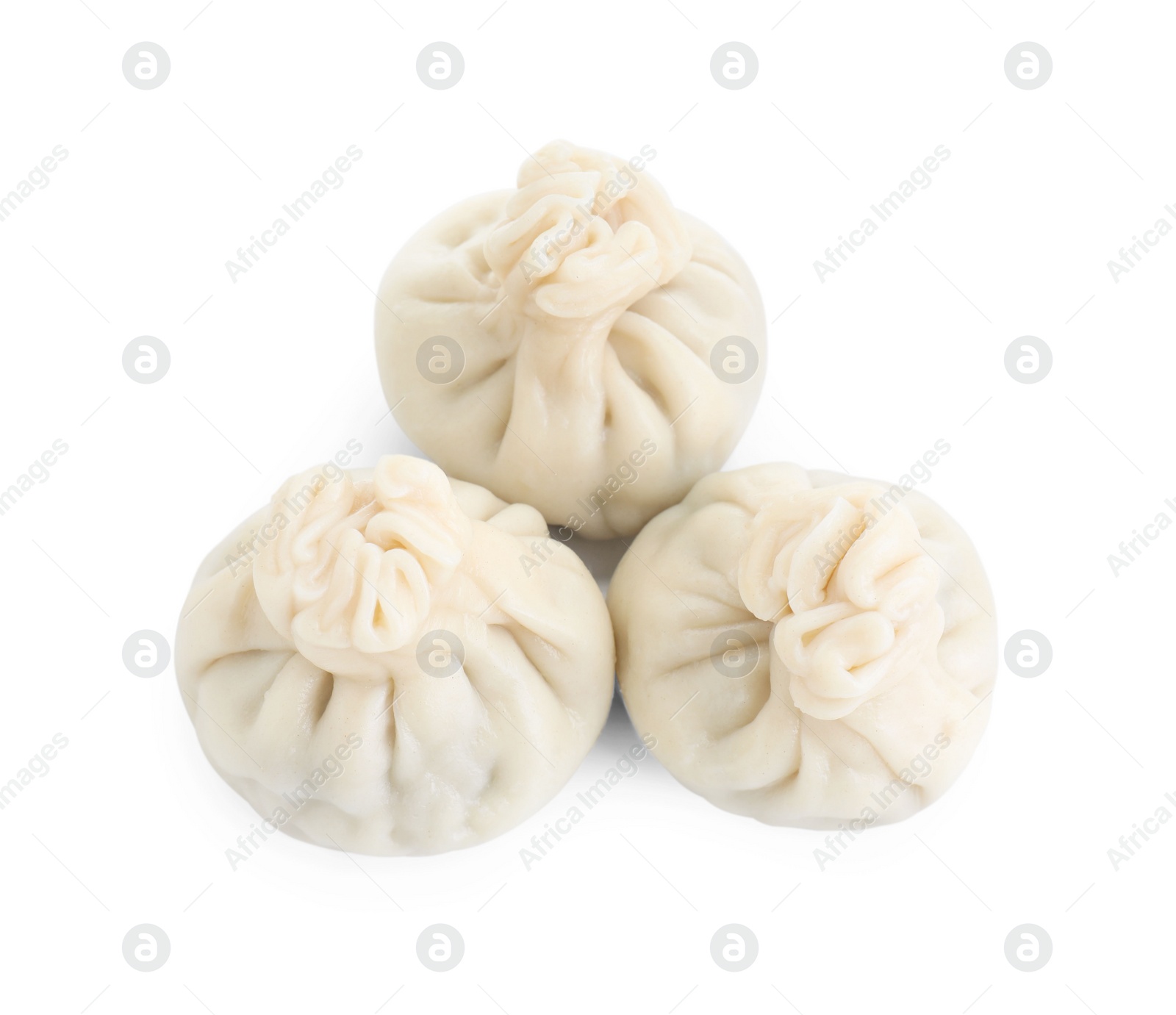 Photo of Three tasty khinkali (dumplings) isolated on white, top view. Georgian cuisine