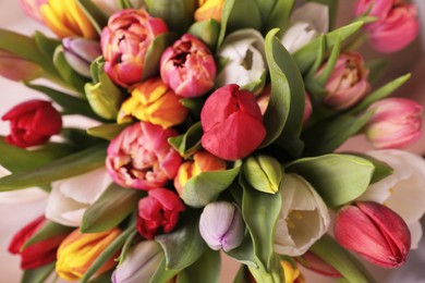 Photo of Beautiful bouquet of colorful tulip flowers, closeup