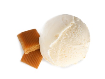 Photo of Scoop of delicious ice cream with caramel candies on white background, top view