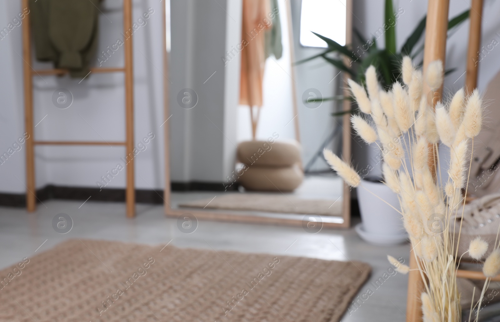 Photo of Beautiful bouquet of dried flowers in hallway