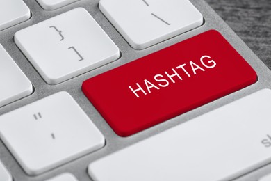 Image of Red button with word HASHTAG on computer keyboard, closeup