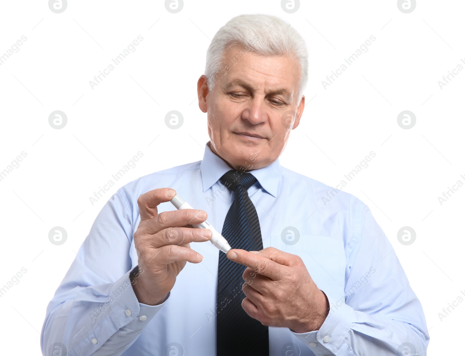 Photo of Senior man using lancet pen on white background. Diabetes control