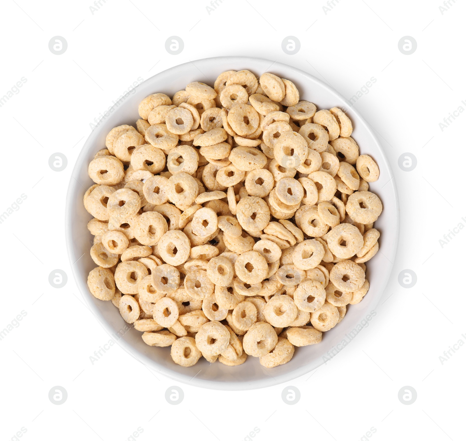 Photo of Tasty cereal rings in bowl isolated on white, top view