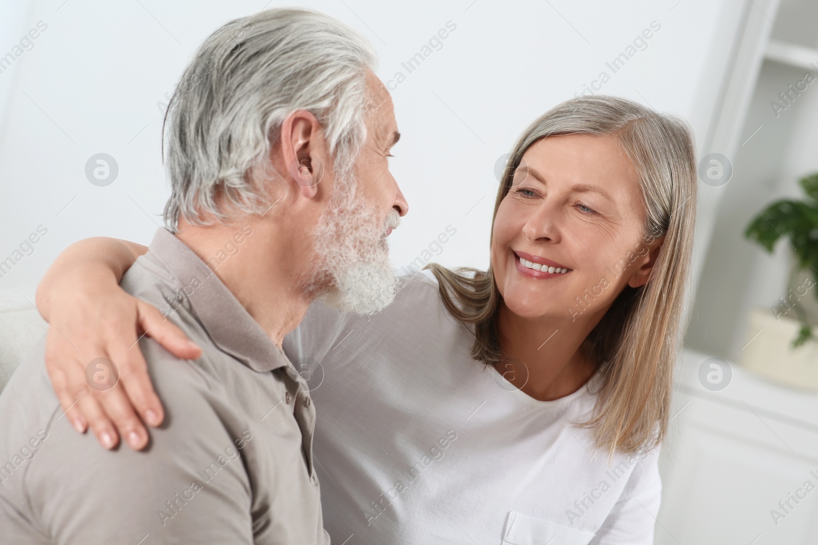 Photo of Happy senior couple spending time together at home