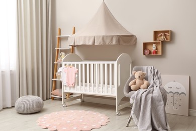Modern baby room interior with stylish crib