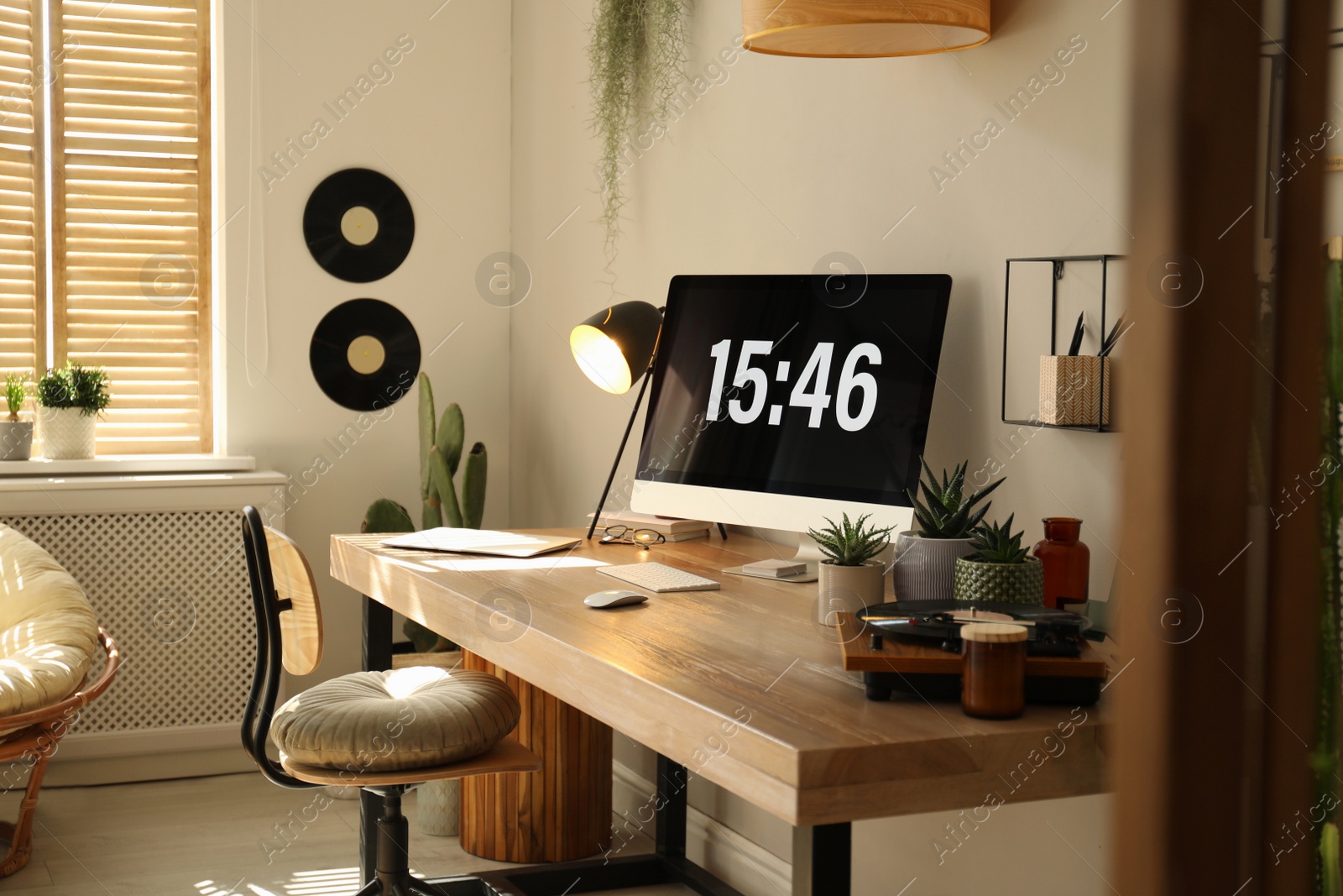 Photo of Room interior with comfortable workplace. Modern computer on wooden desk