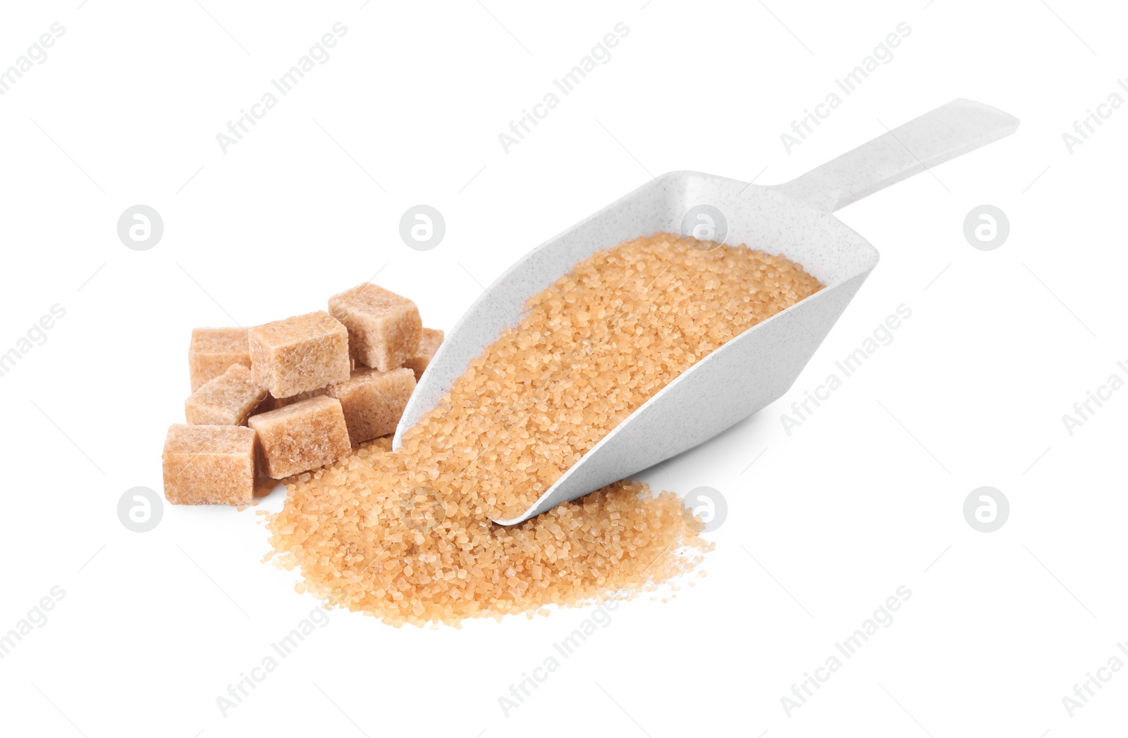 Photo of Different types of brown sugar and scoop isolated on white