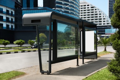 Photo of Modern public transport stop on city street