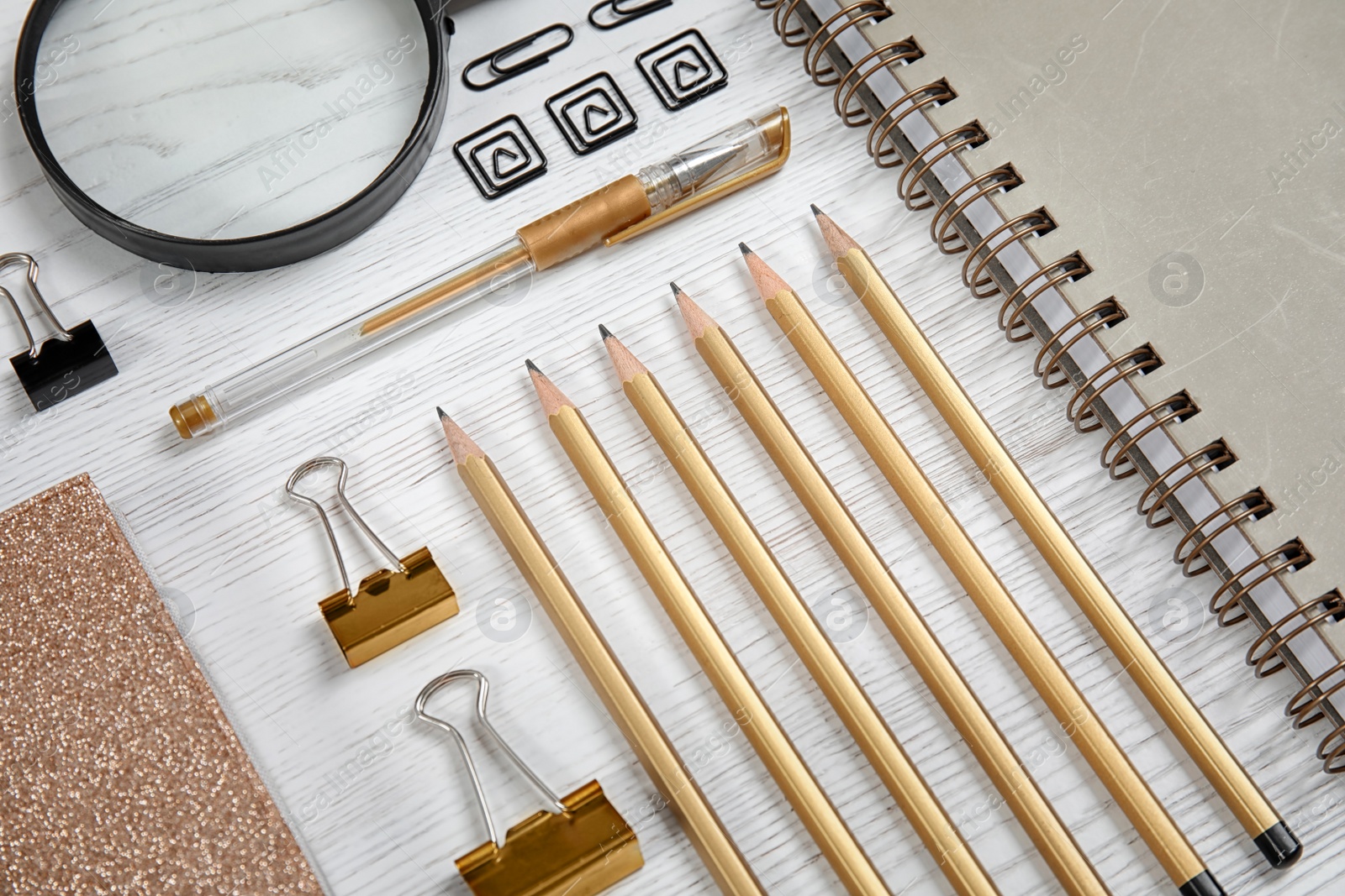 Photo of Different stationery on wooden table. Back to school