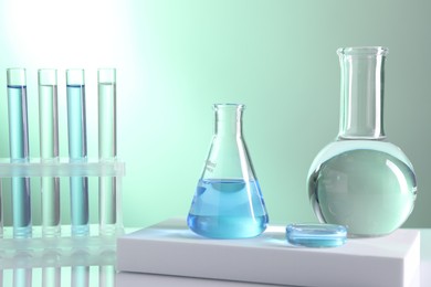 Photo of Laboratory analysis. Different glassware on table against light background