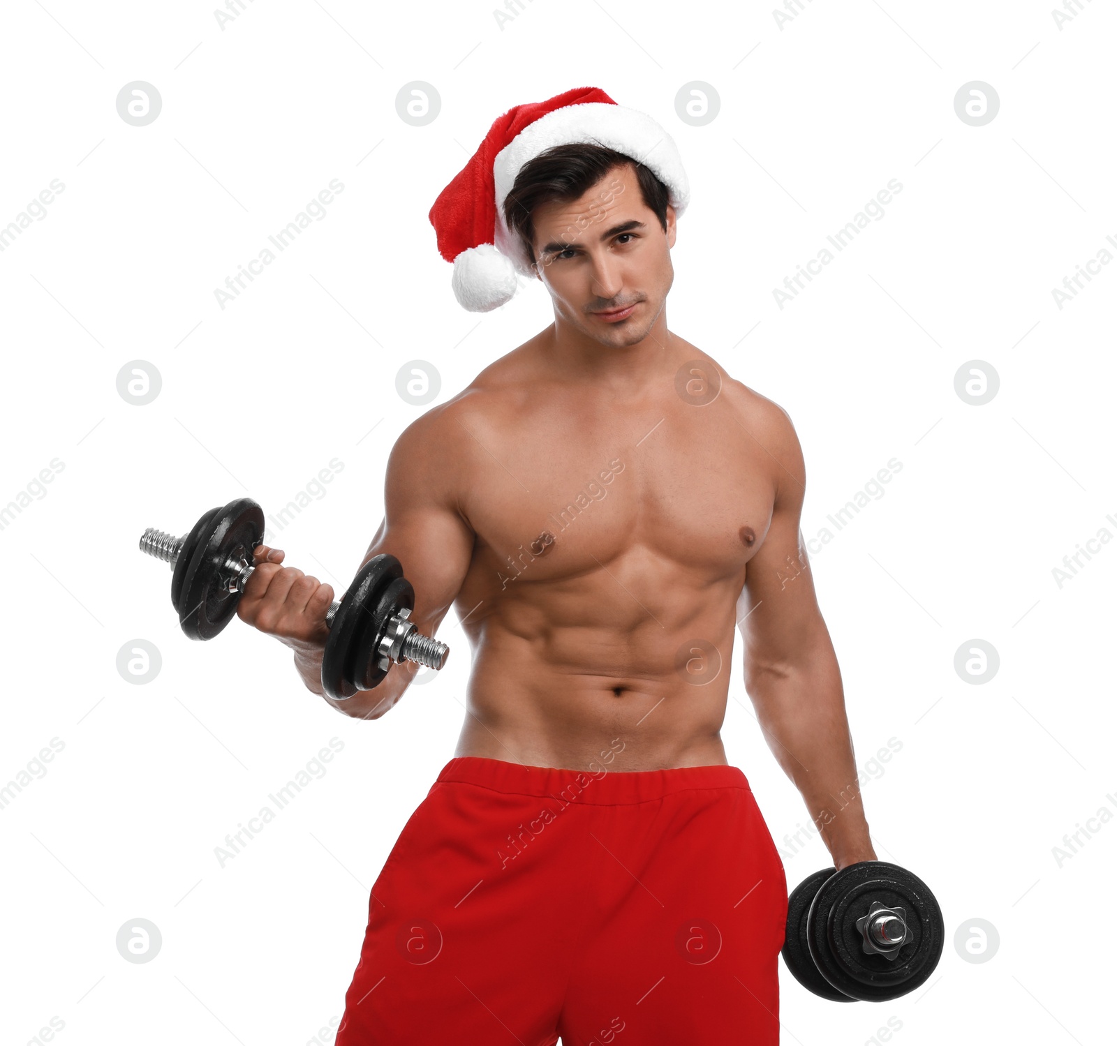 Photo of Sexy shirtless Santa Claus with dumbbells on white background