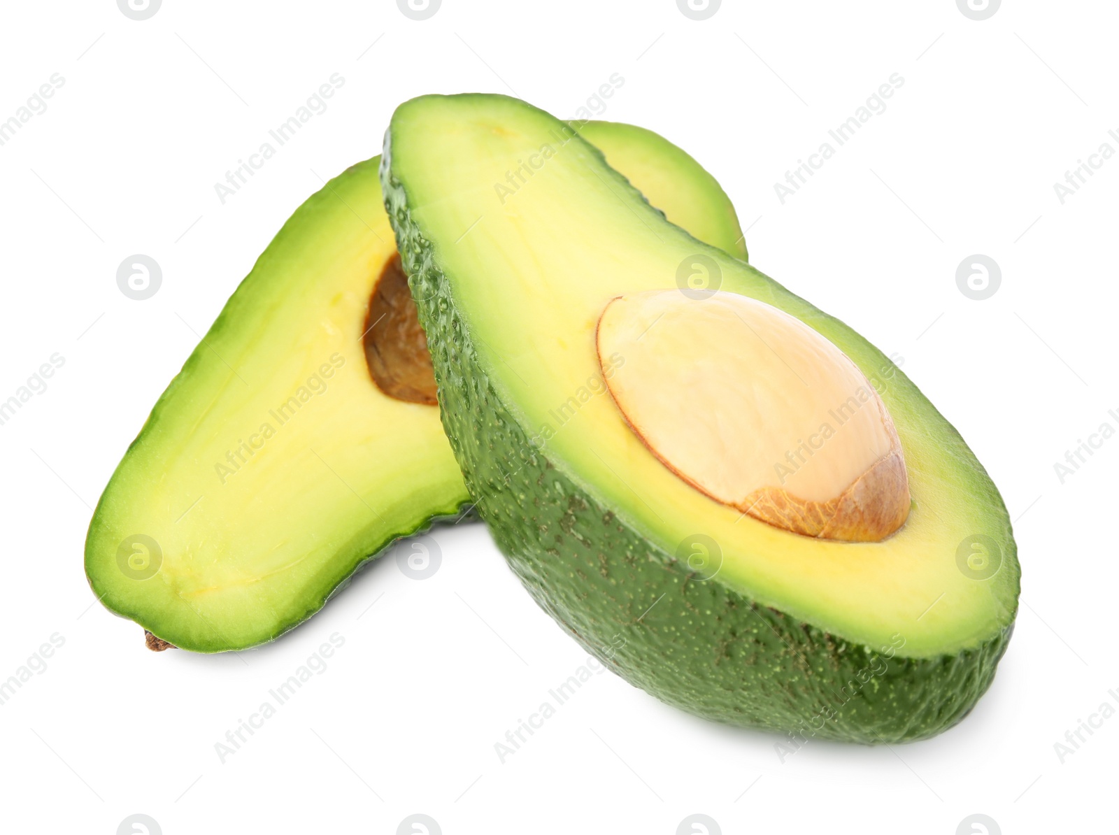 Photo of Cut tasty ripe avocados on white background. Tropical fruit