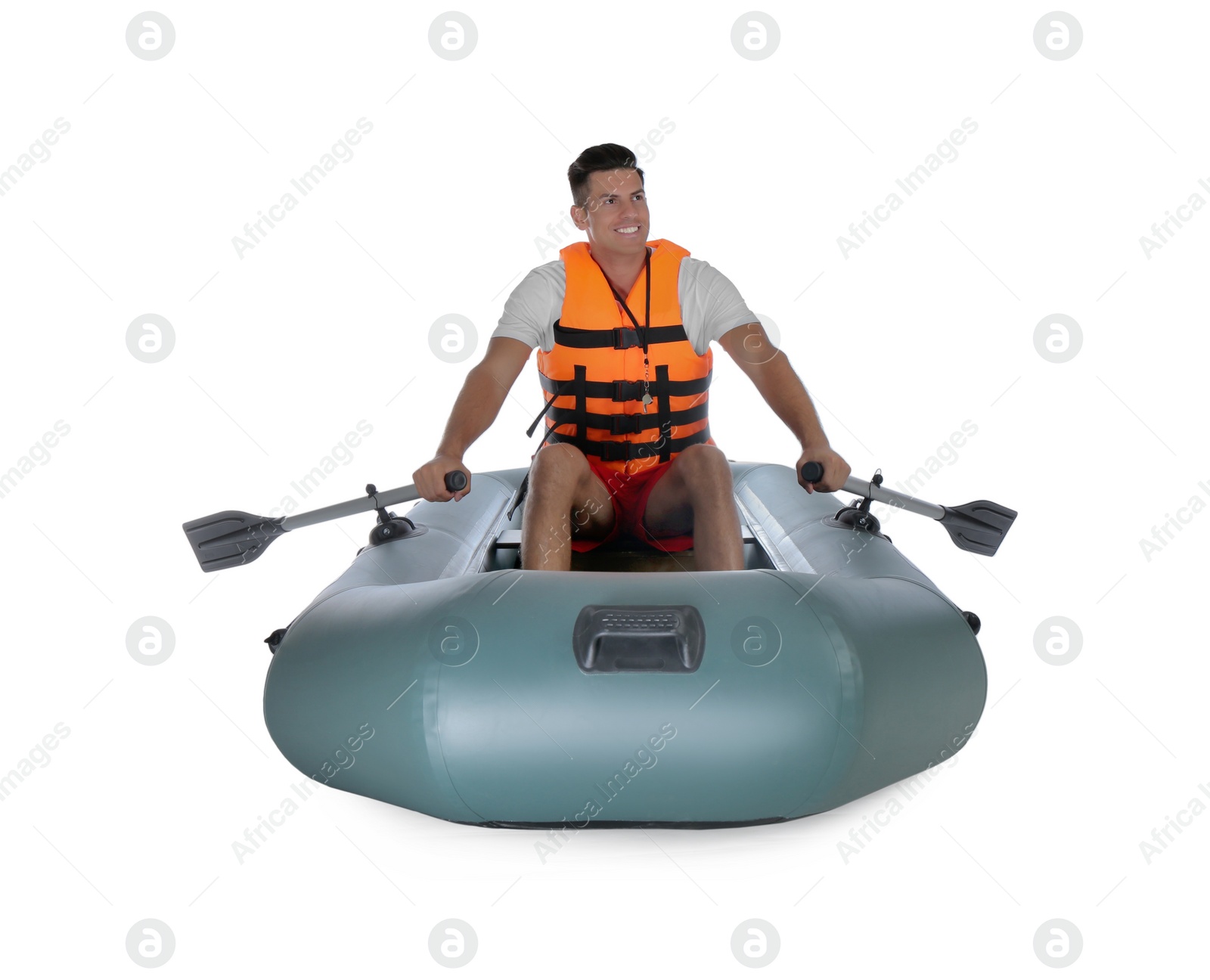 Photo of Man in life vest rowing inflatable rubber boat on white background