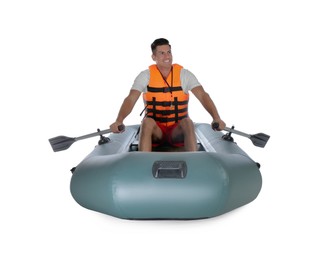 Photo of Man in life vest rowing inflatable rubber boat on white background