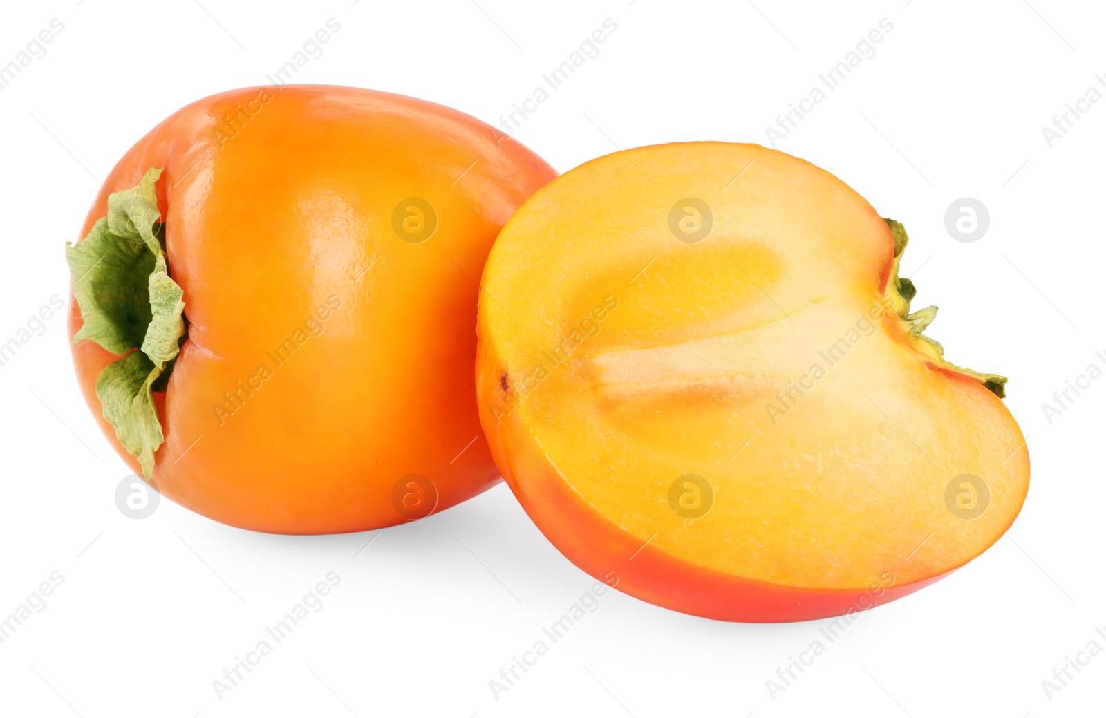 Photo of Whole and cut persimmon fruits isolated on white