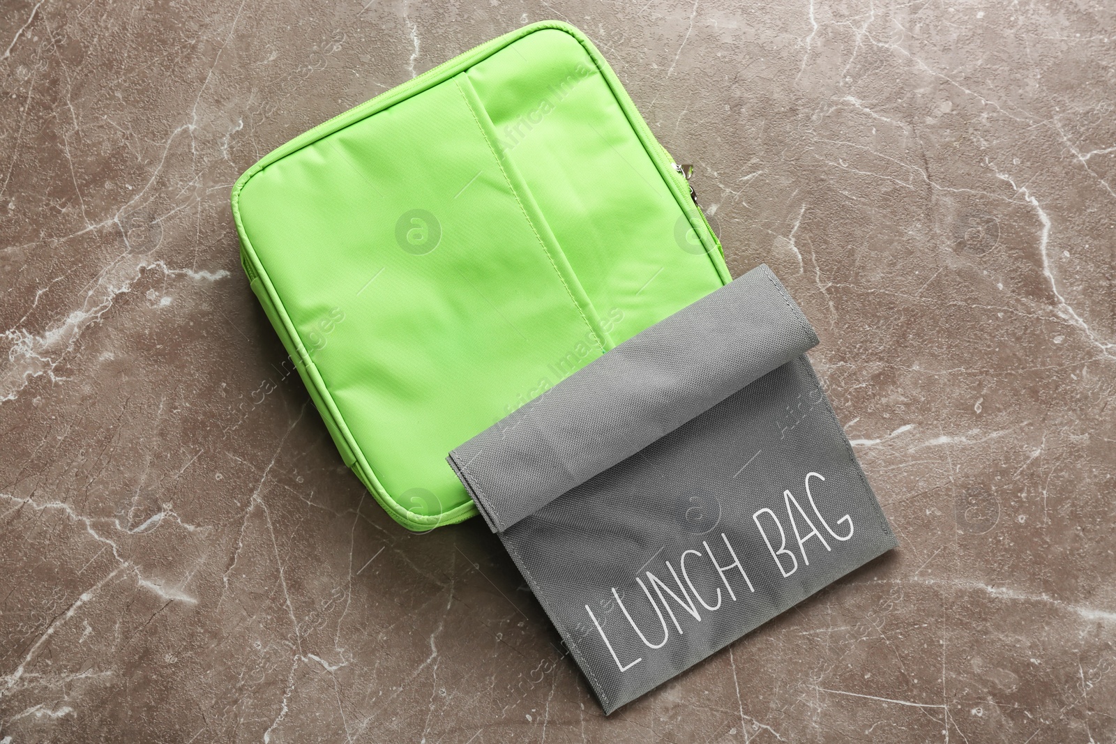 Photo of Lunch bags on gray background, top view