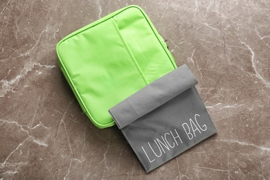 Photo of Lunch bags on gray background, top view