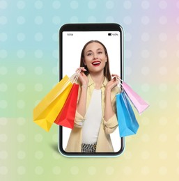 Happy stylish woman with shopping bags looking out huge smartphone on color background. Design for advertising