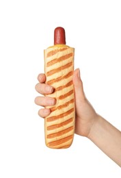 Photo of Woman holding delicious french hot dog on white background, closeup