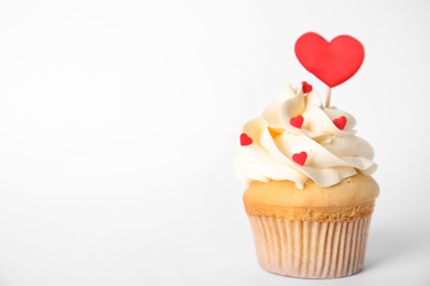Tasty cupcake on white background. Valentine's Day celebration