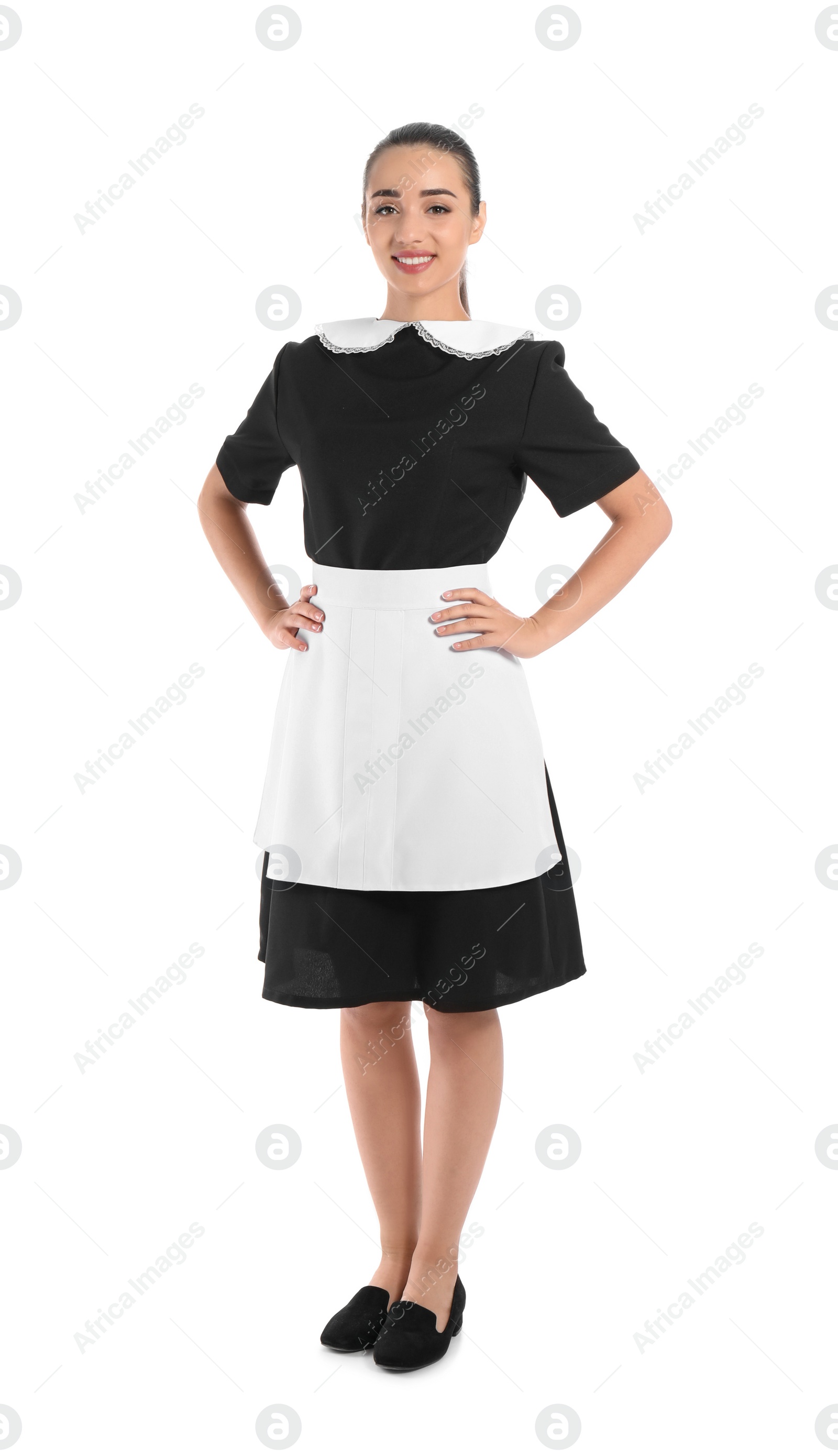 Photo of Full length portrait of young chambermaid in tidy uniform on white background