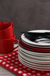 Set of clean dishware and cutlery on table, closeup