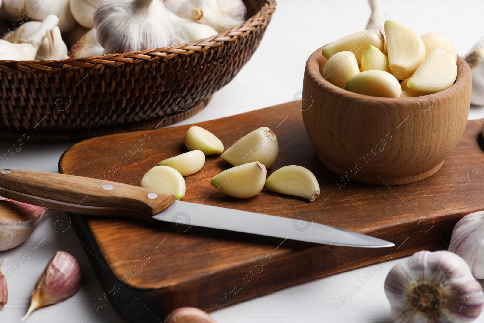 Photo of Fresh ripe garlic on white table. Organic product