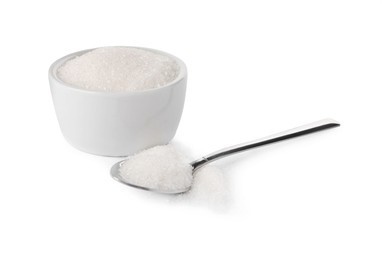 Photo of Bowl and spoon of granulated sugar on white background