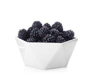 Photo of Bowl with ripe blackberries on white background