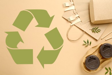 Image of Flat lay composition of eco friendly products and recycling symbol on beige background