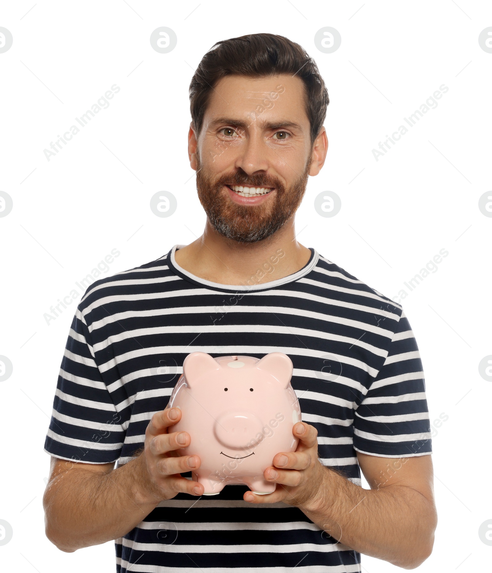 Photo of Happy man with ceramic piggy bank on white background