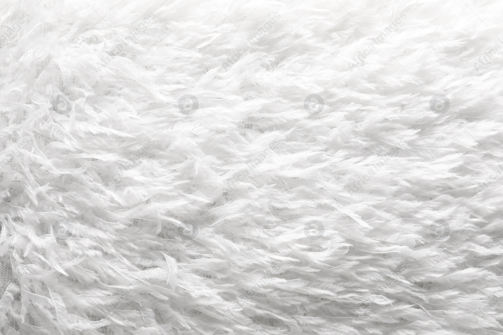 Photo of Texture of white faux fur as background, closeup