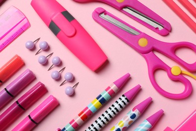 Photo of Flat lay composition with stationery on pink background