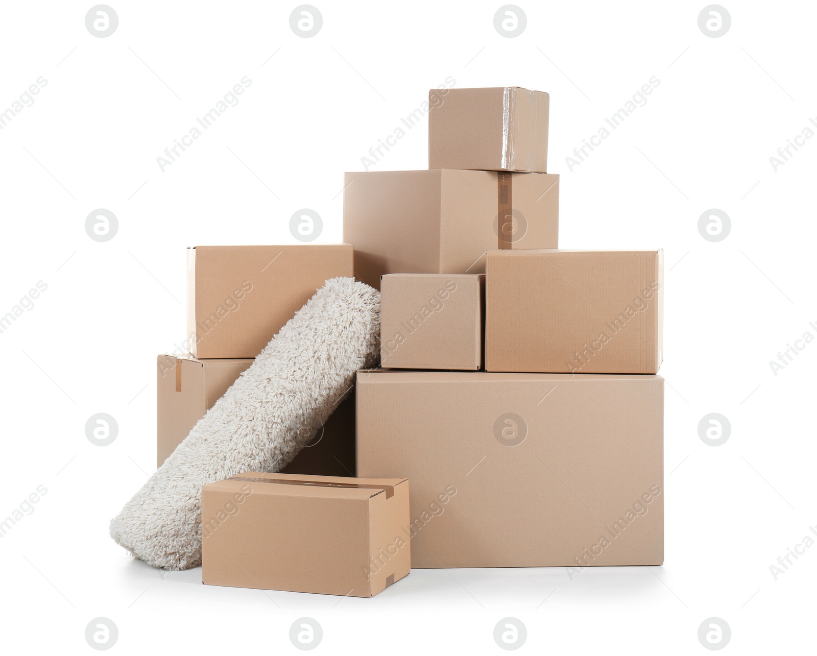 Photo of Cardboard boxes and rug on white background. Moving day