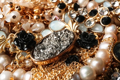 Different stylish jewelry as background, closeup view