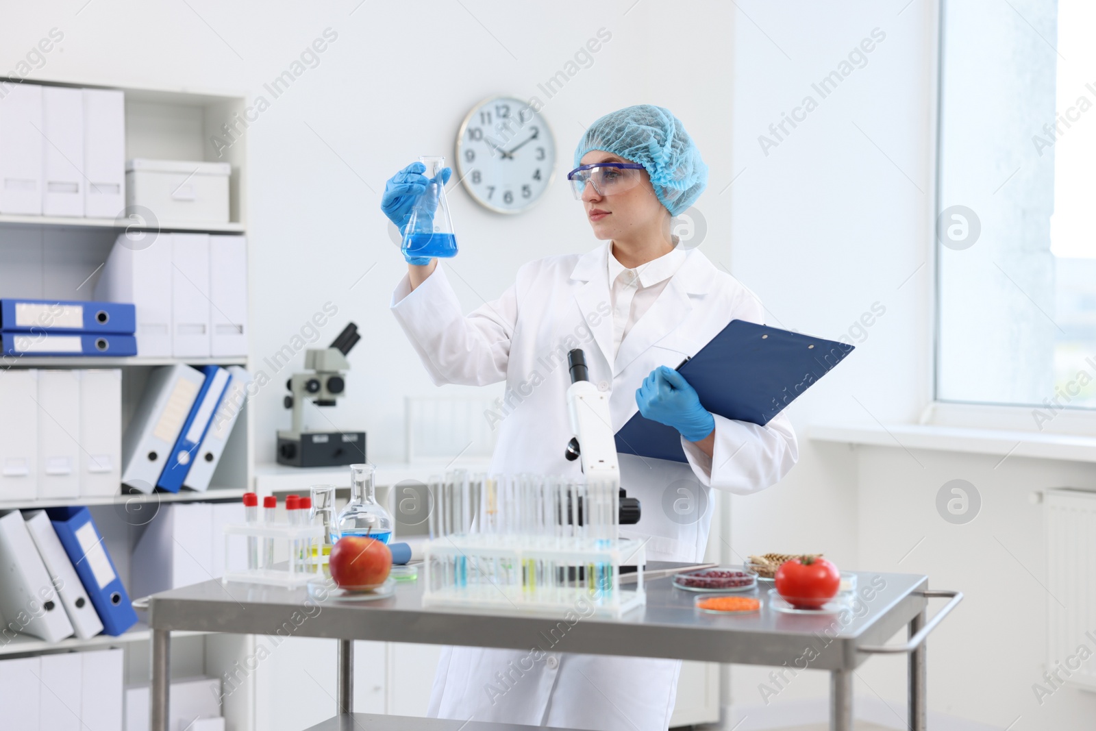 Photo of Quality control. Food inspector checking safety of products in laboratory