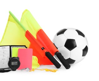 Photo of Football referee equipment. Soccer ball, flags, stopwatch, cards and whistle isolated on white