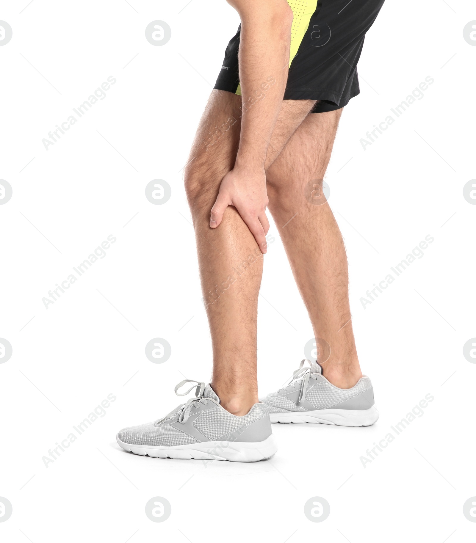 Photo of Man suffering from leg pain on white background, closeup