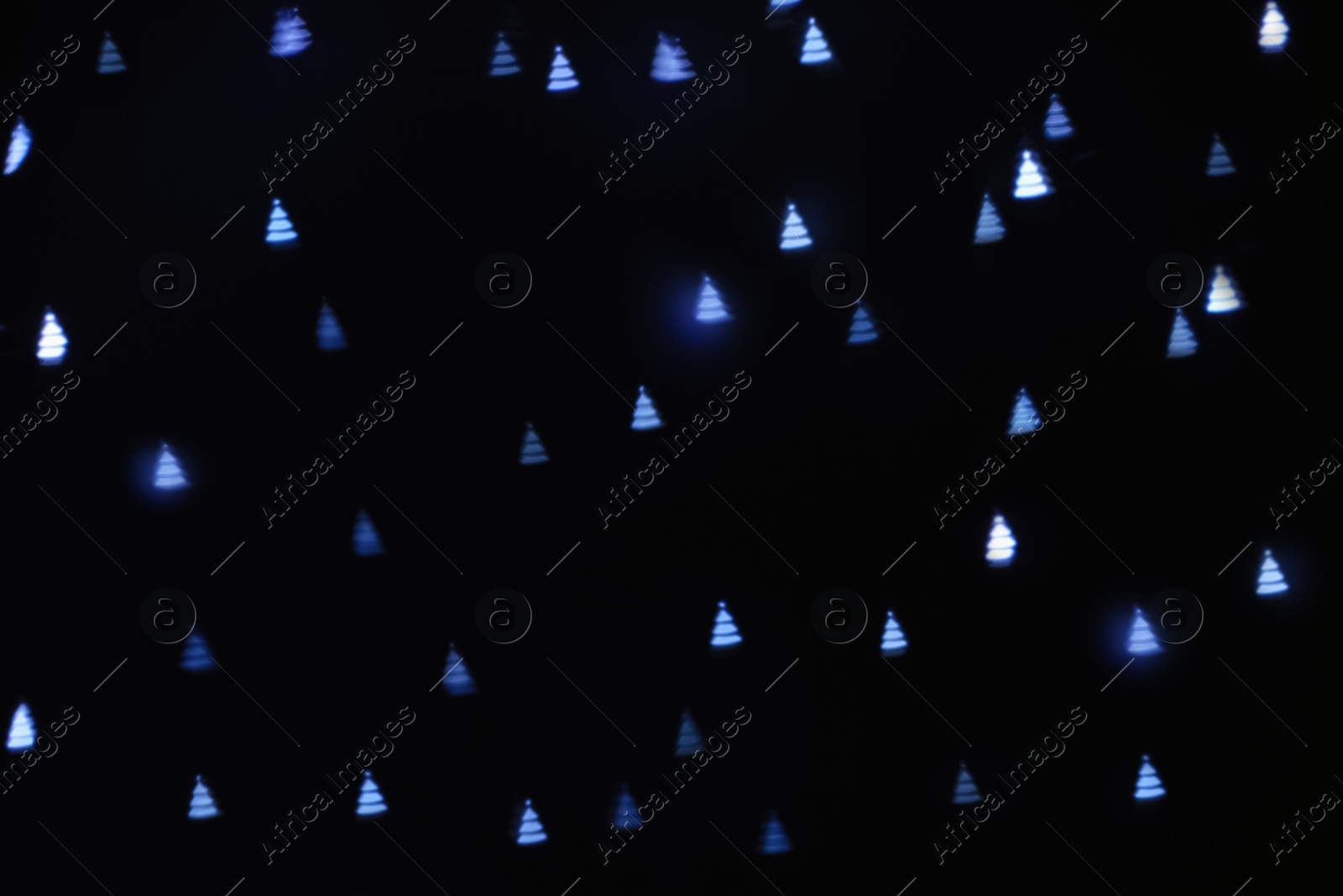 Photo of Beautiful Christmas tree shaped lights on dark background