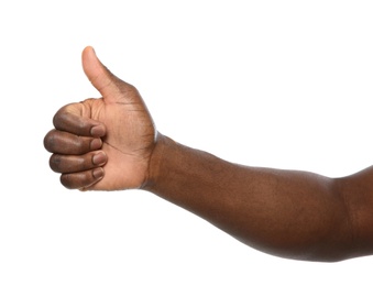 African-American man showing thumb up gesture on white background, closeup