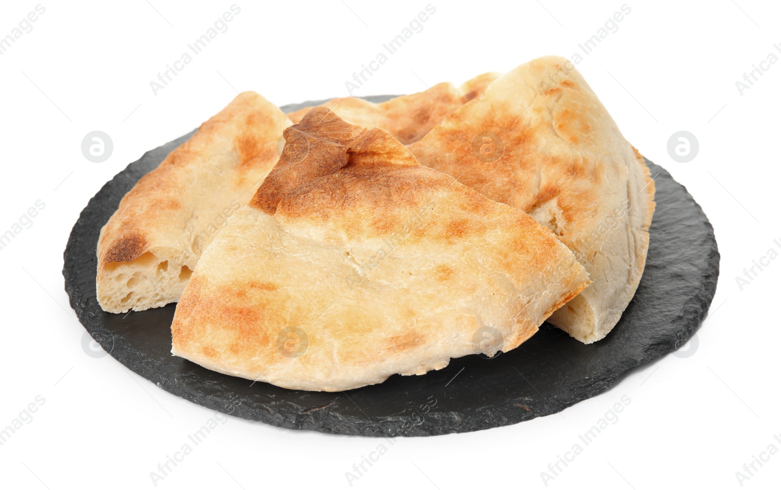 Photo of Cut fresh pita bread with slate plate on white background